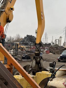 Scrap Yard Near Me | Heavy Excavator in Action at Metal Processing Facility
