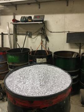 Scrap Yard Near Me | Scrap Aluminum Shavings in Recycling Drums