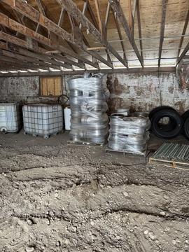 Scrap Yard Near Me | Stacked Aluminum Rims and Scrap Metal Storage